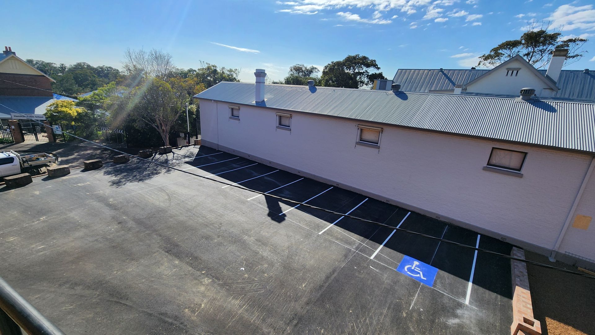 Exterior View of a Building With a Parking Lot — TAC Asphalt Services in Warners Bay, NSW