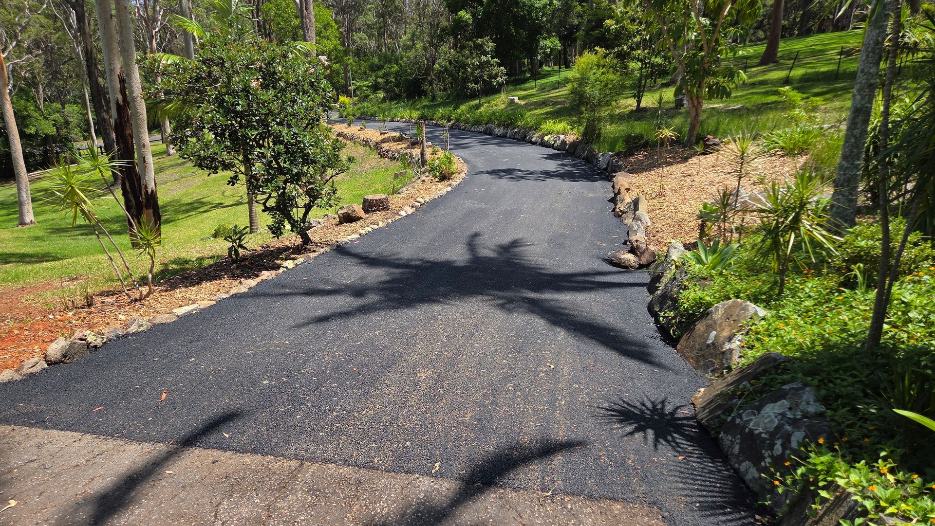 Gravel Path Winding Through A Green Landscape — TAC Asphalt Services in Warners Bay, NSW