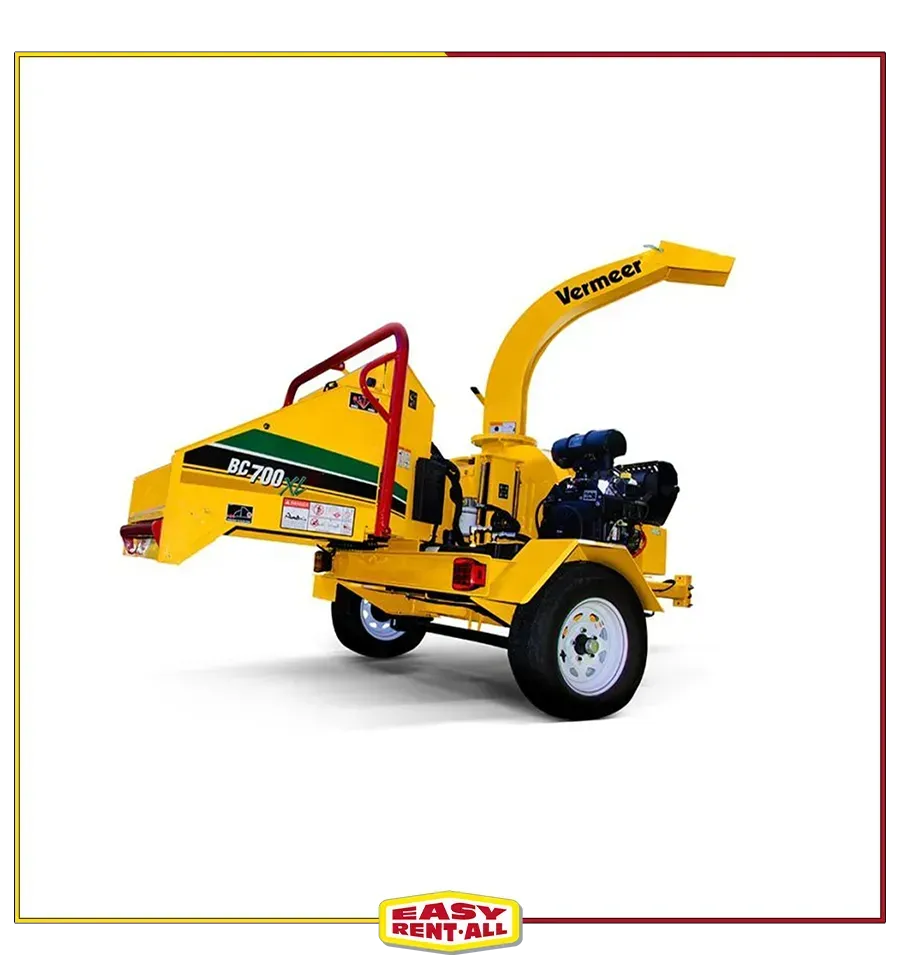 A yellow tree chipper is sitting on a white surface.