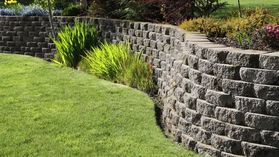 Constructing a Retaining Wall: Steps and Equipment Rentals
