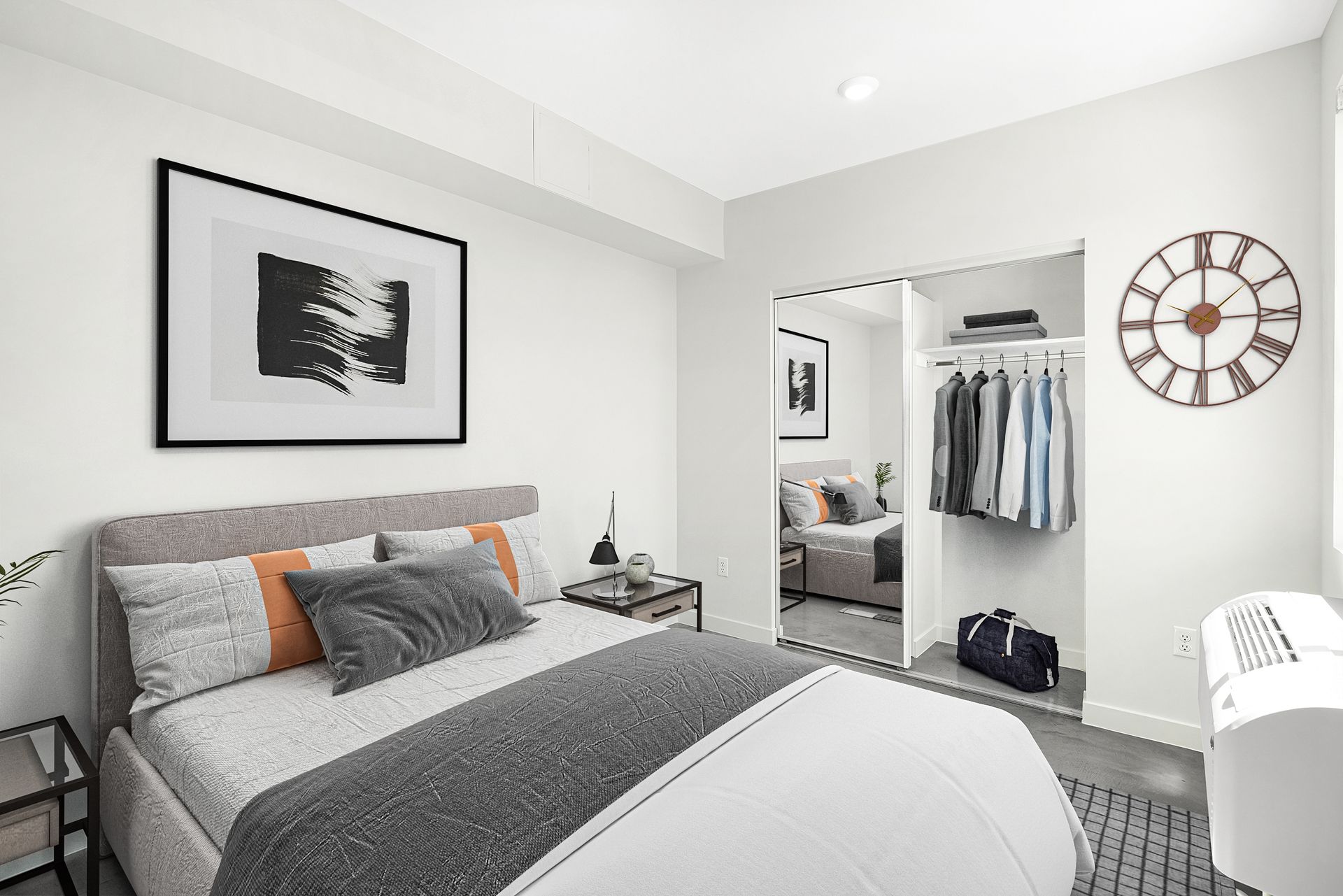 A bedroom with a large bed and a clock on the wall.