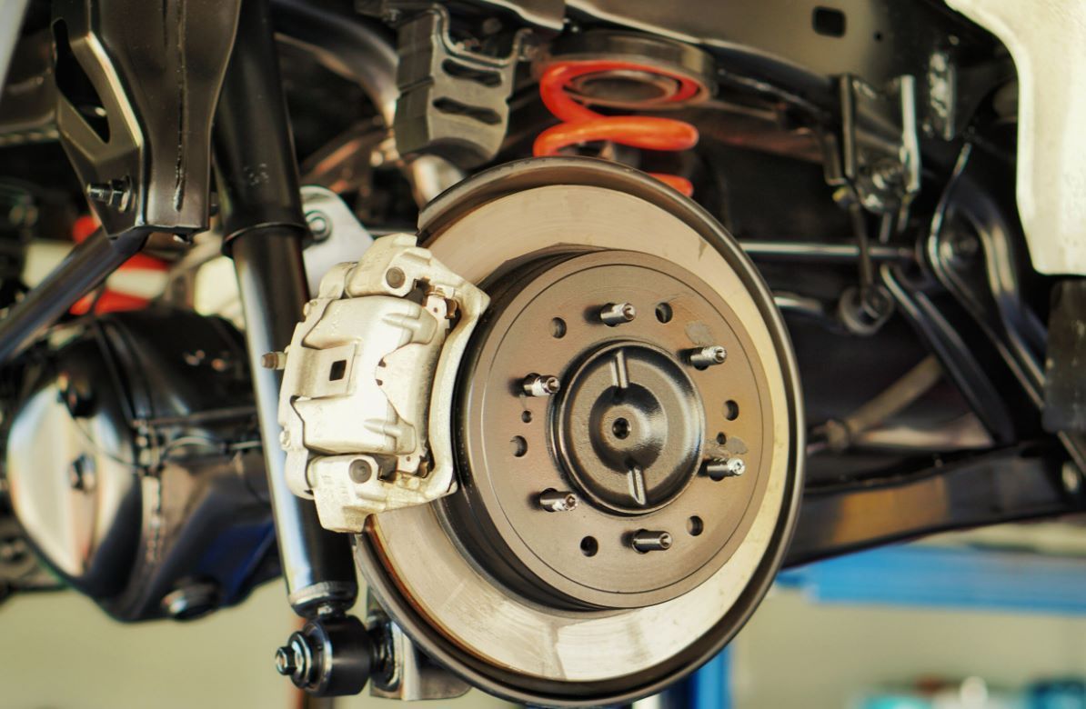 A Close Up of a Car 's Brake System on a Lift — NT Auto Repairs in Winnellie, NT