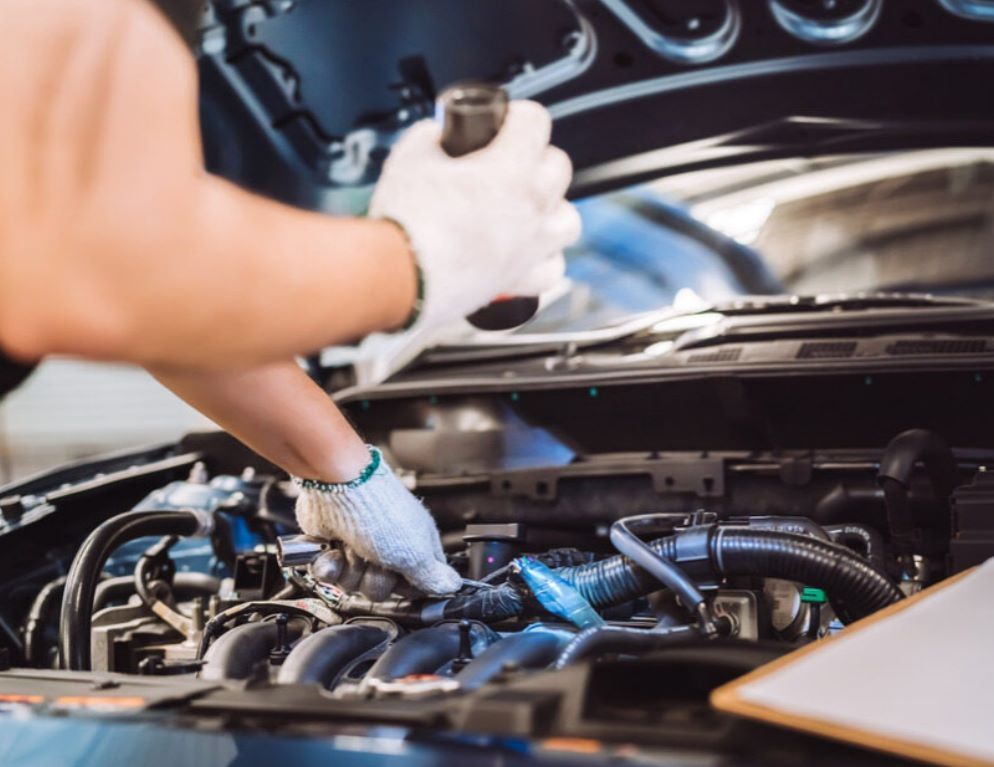 A Man is Working on the Engine of a Car — NT Auto Repairs in Winnellie, NT
