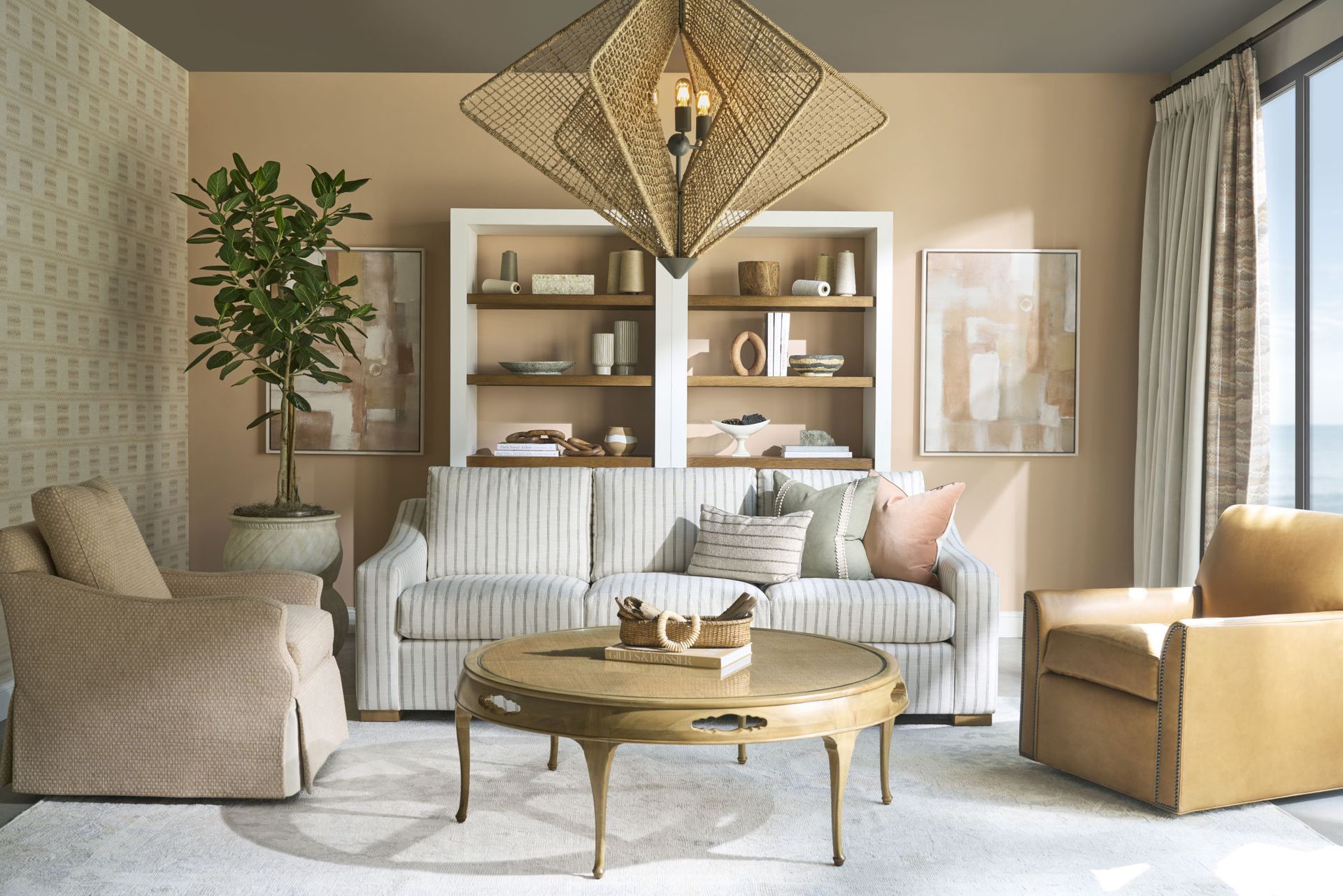 Cozy neutral living room with gray sofa, armchair, rustic coffee table, baskets, and framed wall art