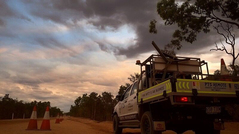A truck is parked on the side of a dirt road — PTS Traffic Management in Smithfield, QLD