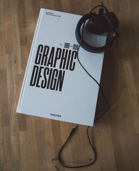 a brochure with a man shaking hands on it is sitting on a table .