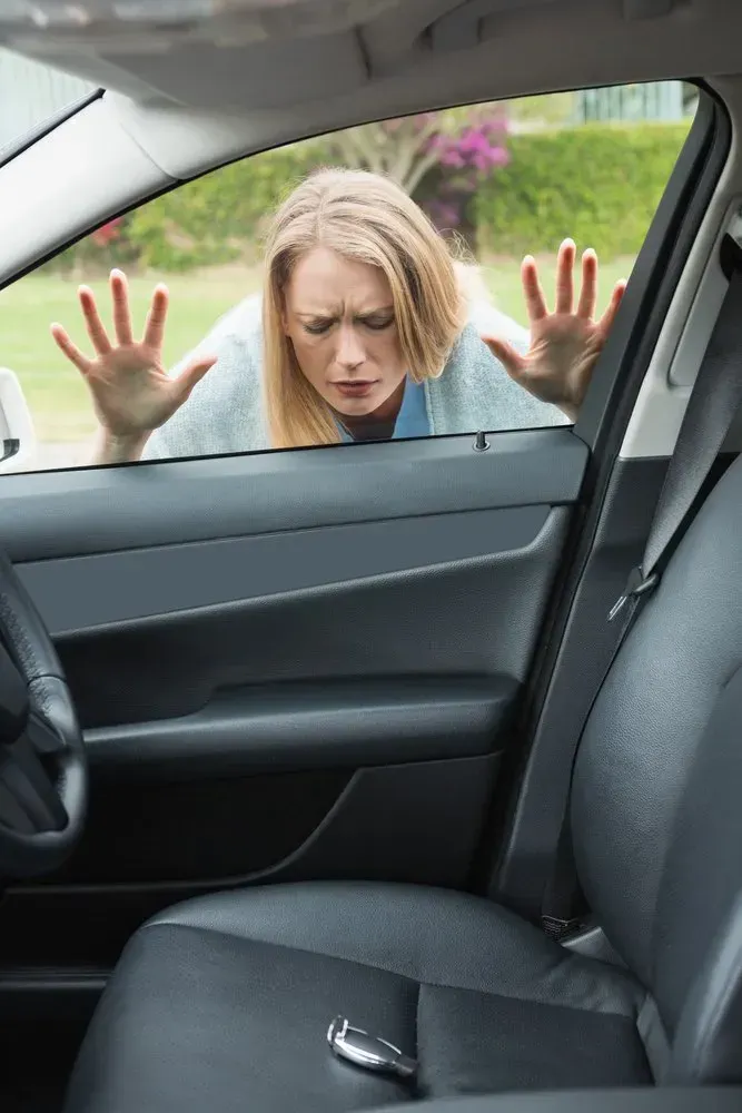 Woman Locked Out of Car, Looking Frustrated, Hands on Window — Lady Locksmith in Mackay, QLD