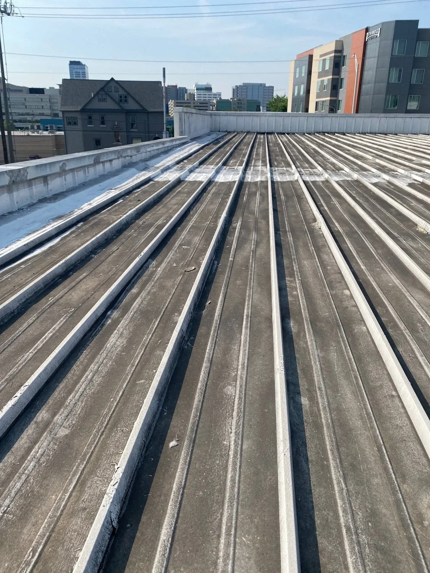 Aged and discolored metal roof surface before restoration in Nashville, Tennessee