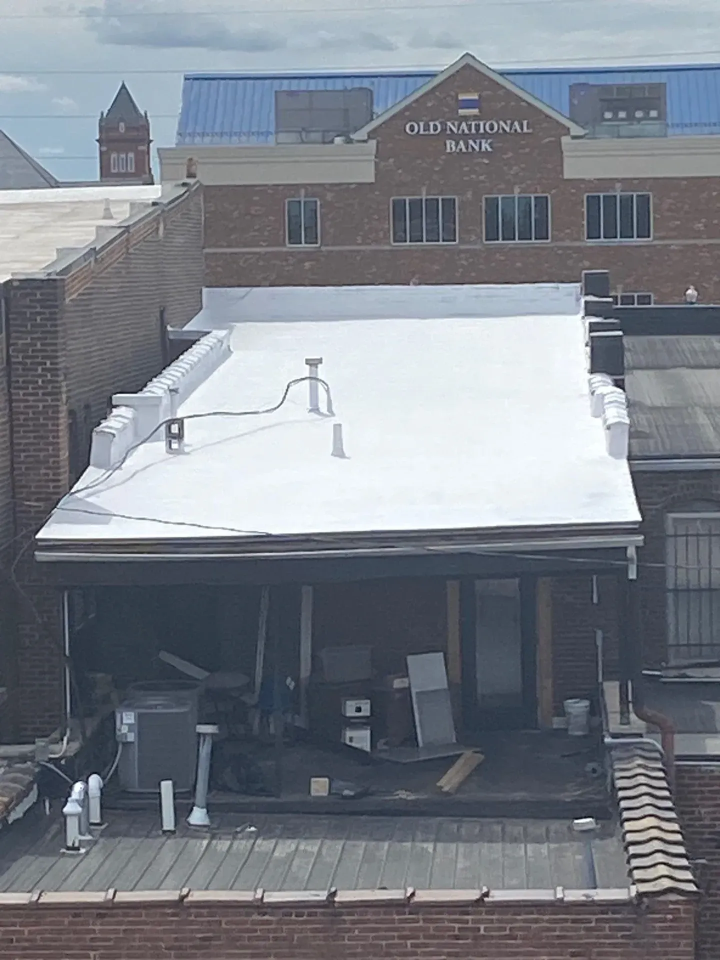Completed white single-ply membrane roof replacement in downtown Owensboro, Kentucky