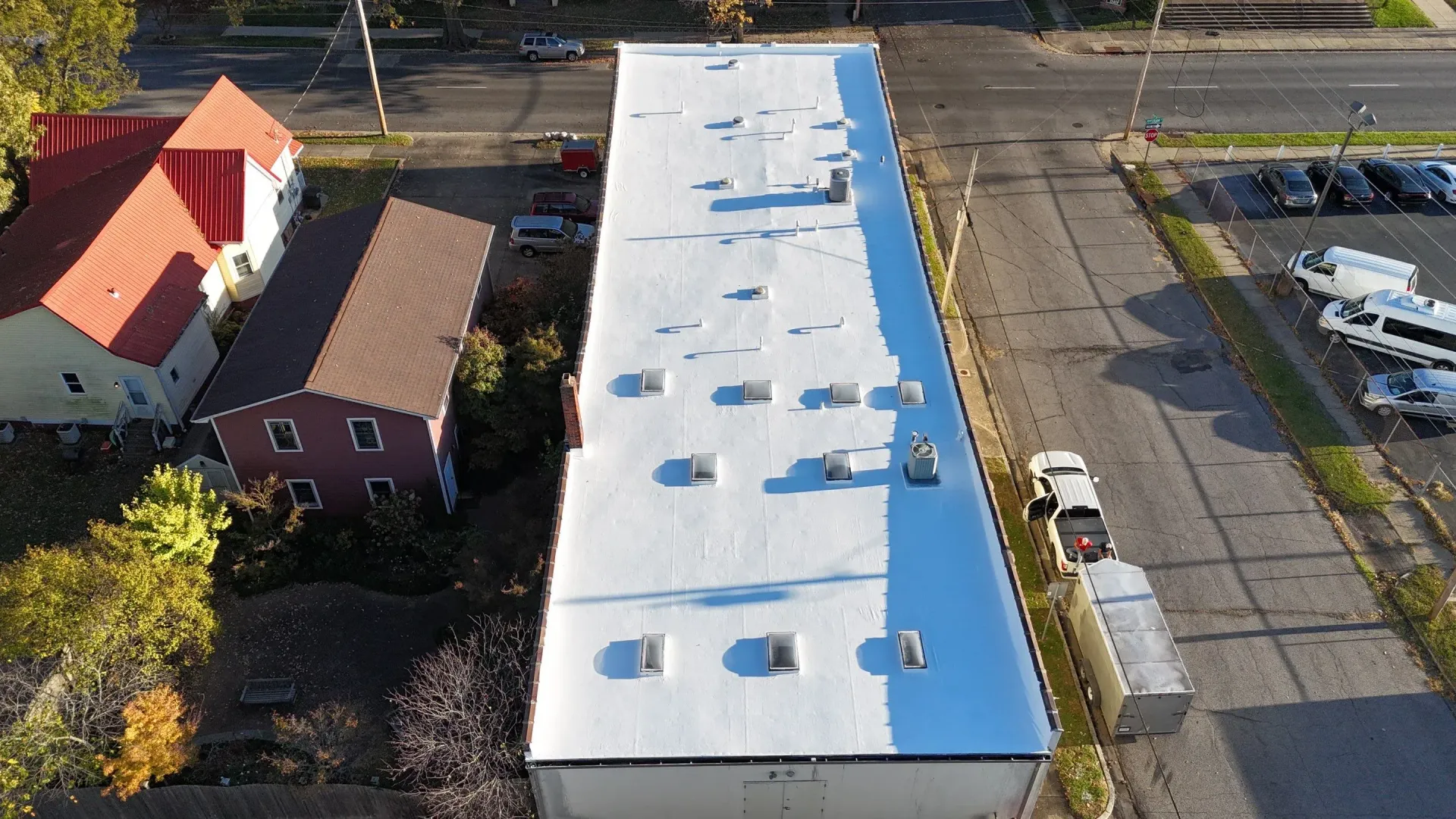 Aerial view of completed white reflective roof coating restoration in Paducah, Kentucky