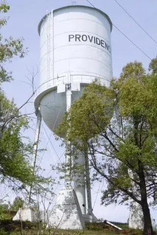 Providence, Kentucky water tower surrounded by trees
