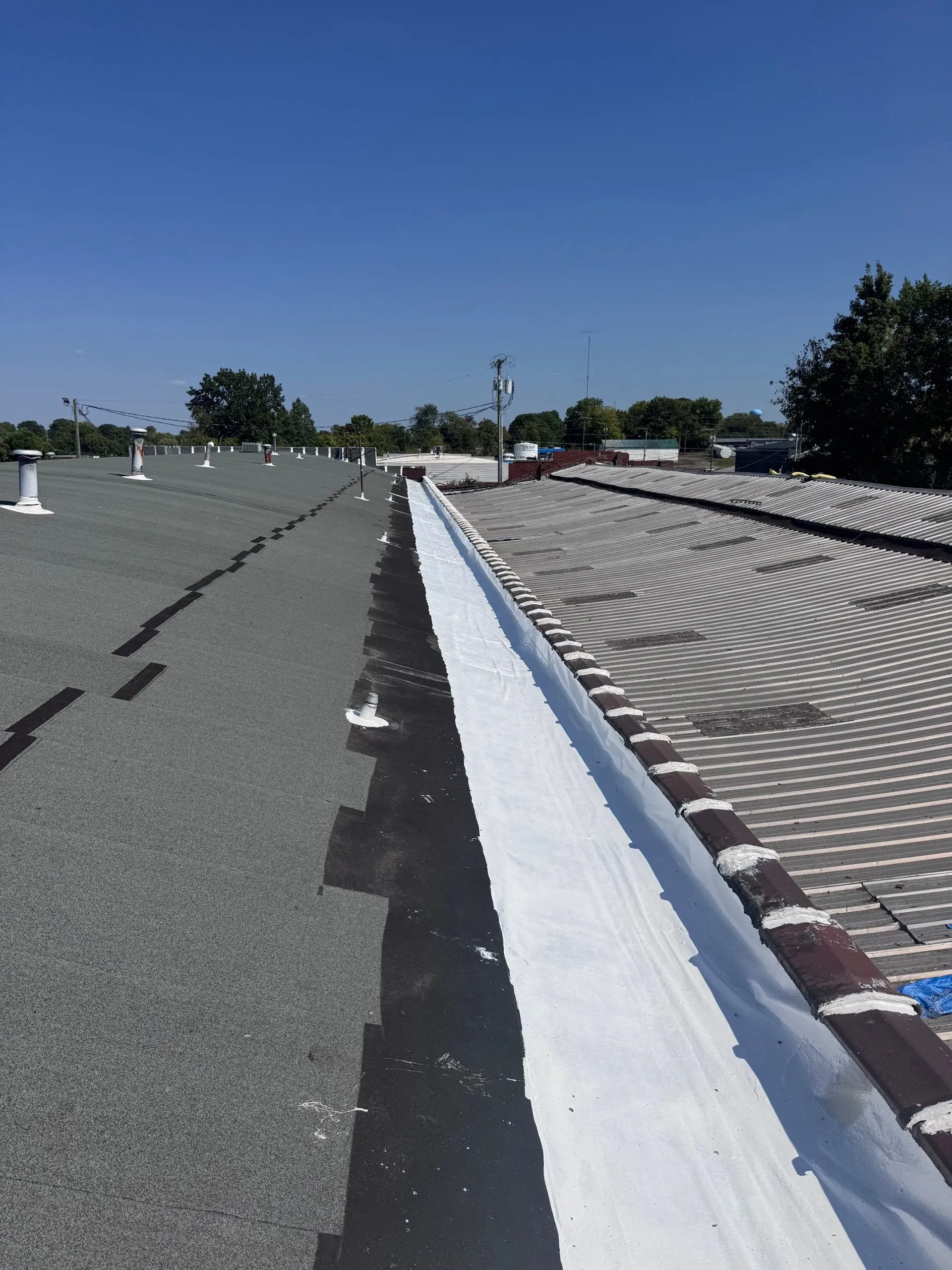 New fabric-reinforced flashing installed along a roof valley after restoration in Springfield, Tennessee