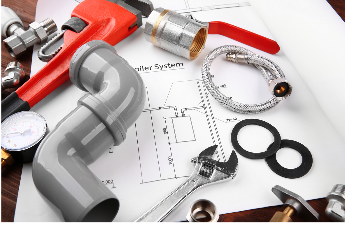 A bunch of plumbing tools laying on top of a piece of paper