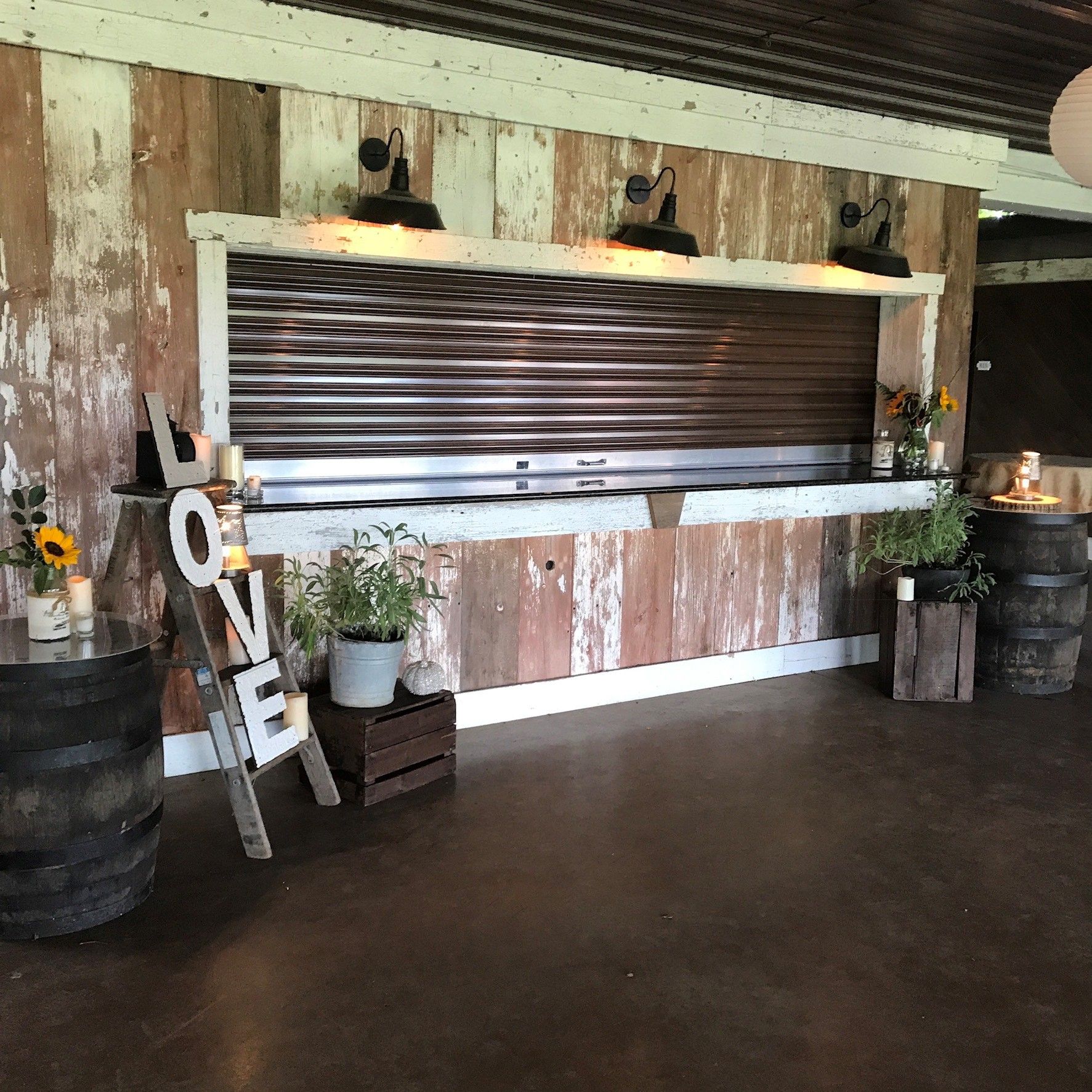 A room with barrels and a sign that says love