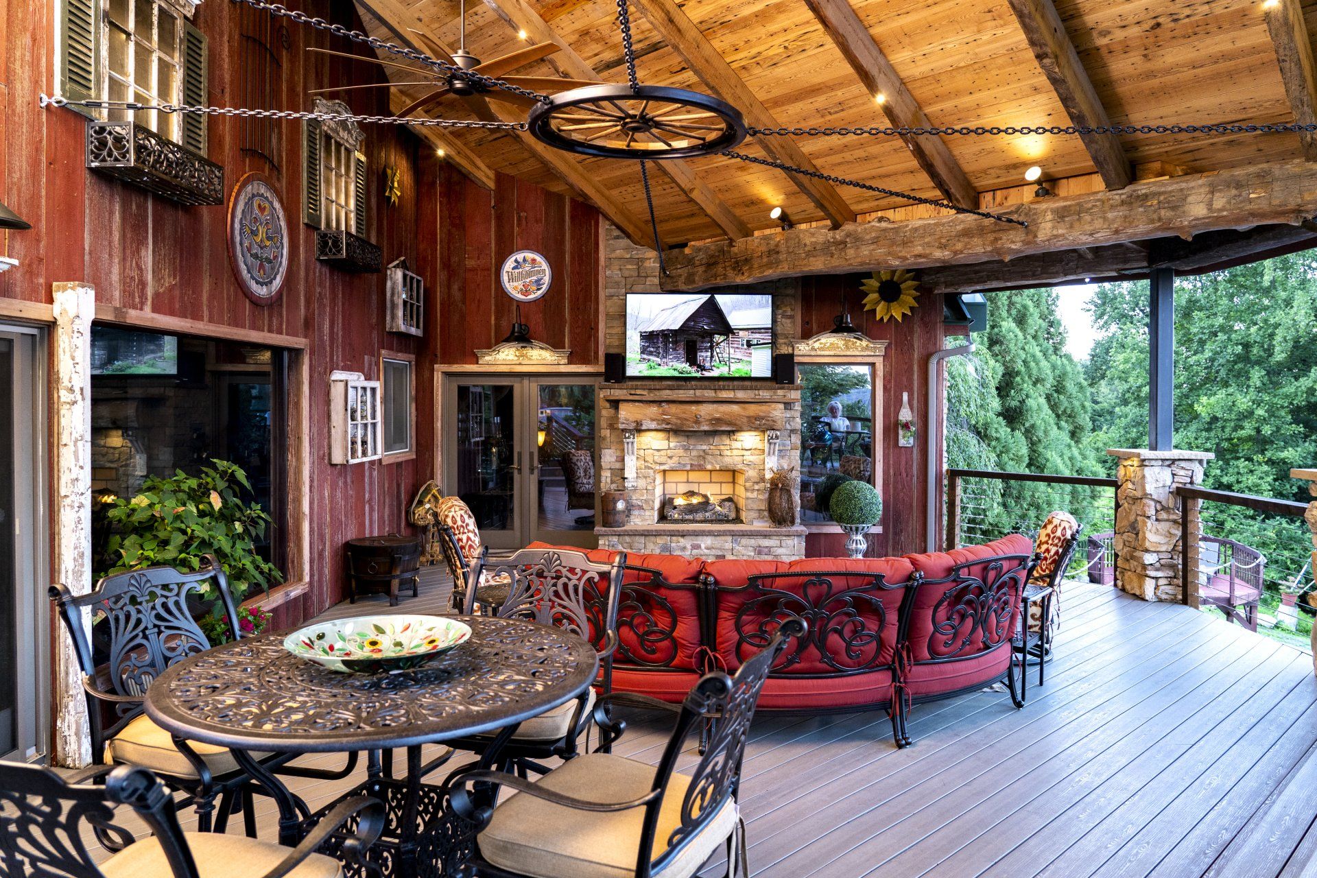 A patio with a table and chairs and a fireplace.