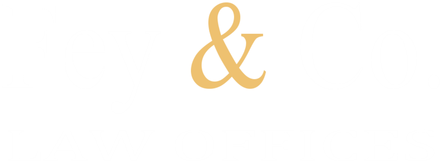 A light gold ampersand symbol centered on a black background.
