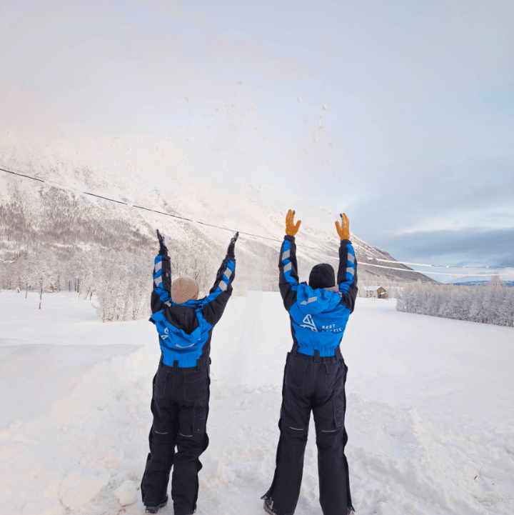 Snowmobile activity in Tromso city people dressed in winter clothing 