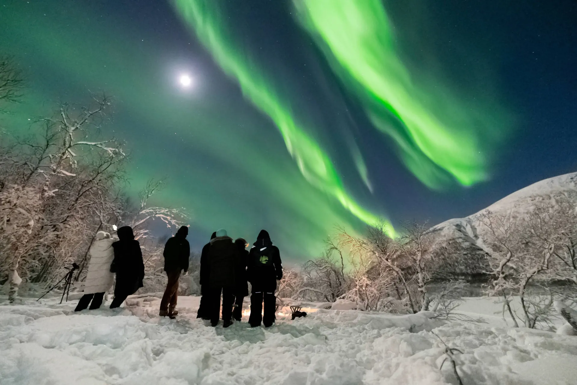 camera set on tripod capturing the northern lights