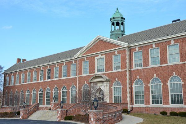 A large brick building with a clock tower on top