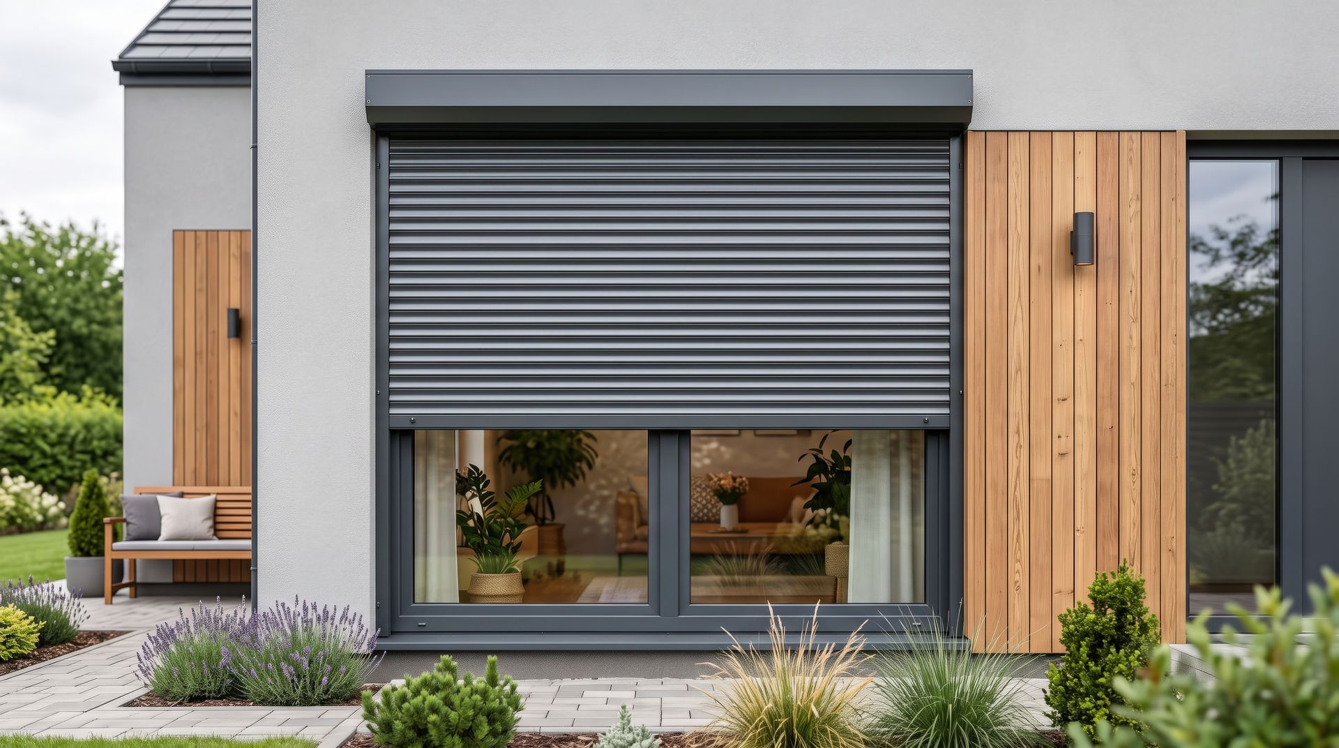 Modern house exterior with gray roller shutter, wood siding, and large windows