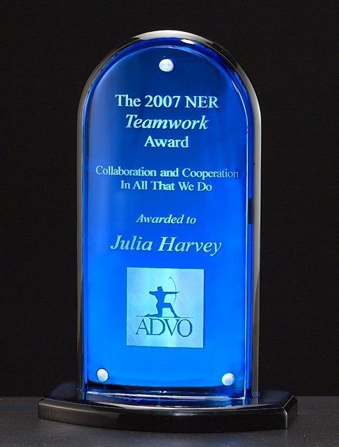 Arch shape upright acrylic award with blue background.