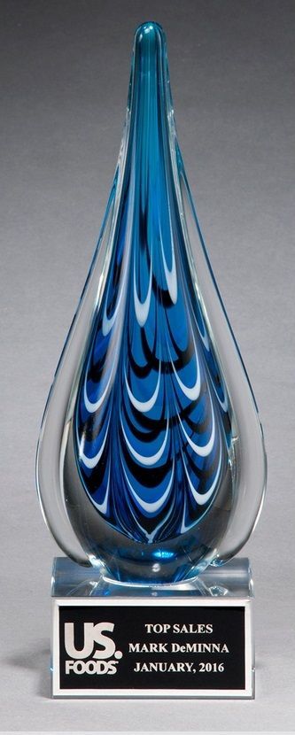 Blue and black teardrop shape glass recognition award.