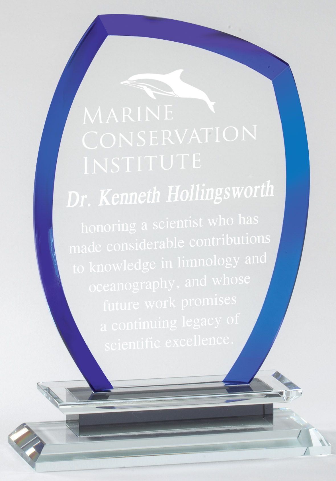 Crystal recognition award with blue border.
