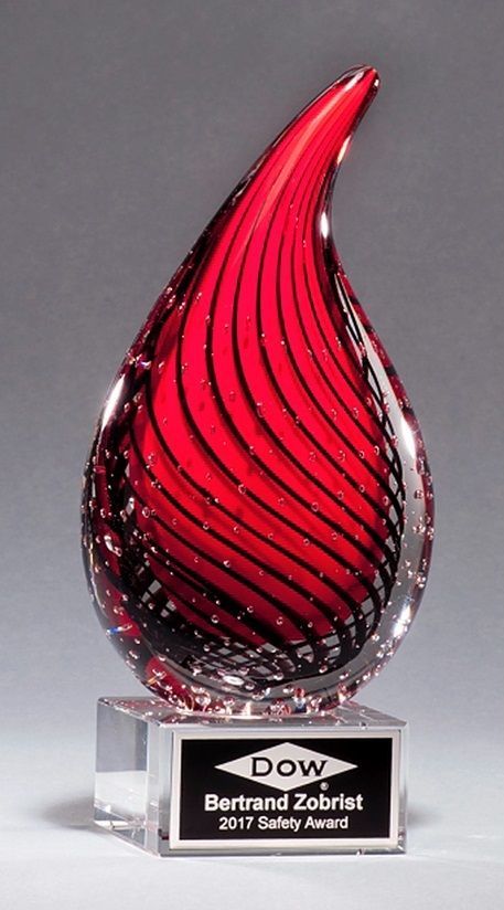 Red droplet shape glass recognition award.
