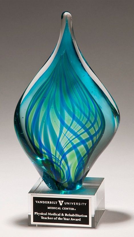 Flame shaped blue and green art glass recognition award.