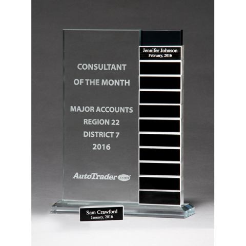 Clear glass monthly award plaque with stackable name spots.