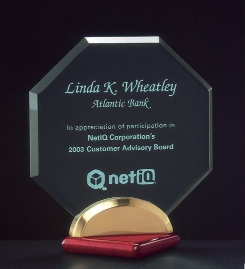 Beveled octagon shaped acrylic recognition award with rosewood piano finish base.