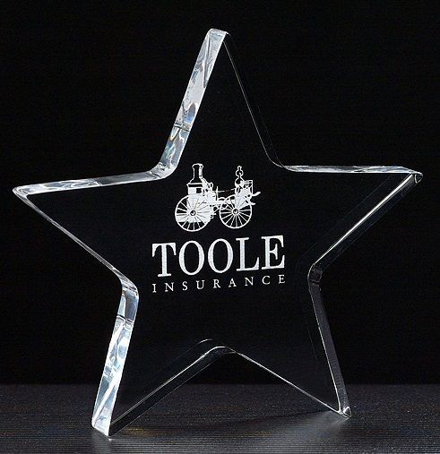 Star shape clear acrylic paperweight.