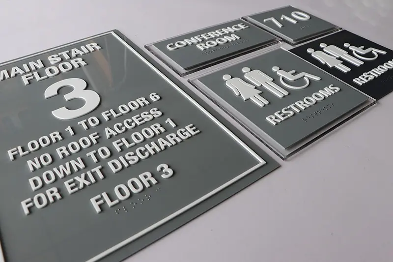 ADA compliant raised letter/braille floor signs.