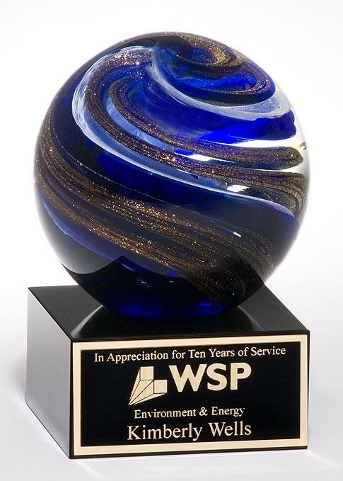 Blue and gold ball shape glass recognition award.
