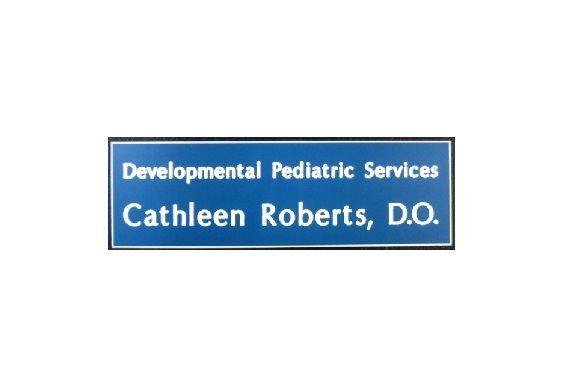 Laser engraved blue name badge featuring business name, name, and title.