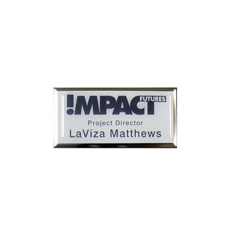 Sublimated brushed aluminum name badge with protective dome on large silver premier frame.