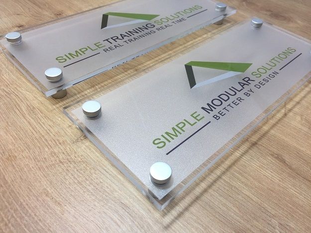 Colorful branded acrylic wall office sign.