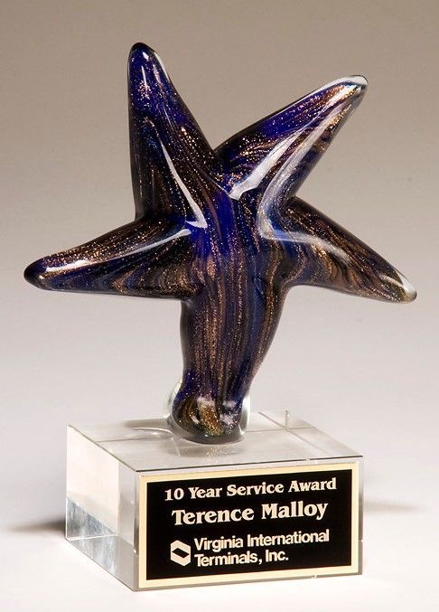 Star shaped blue, black, and gold art glass recognition award.
