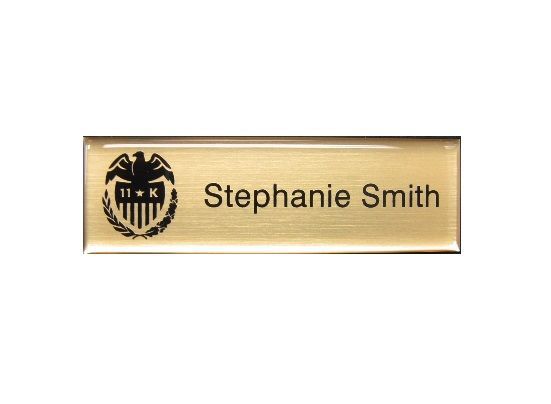 Laser engraved gold name badge with protective doming.