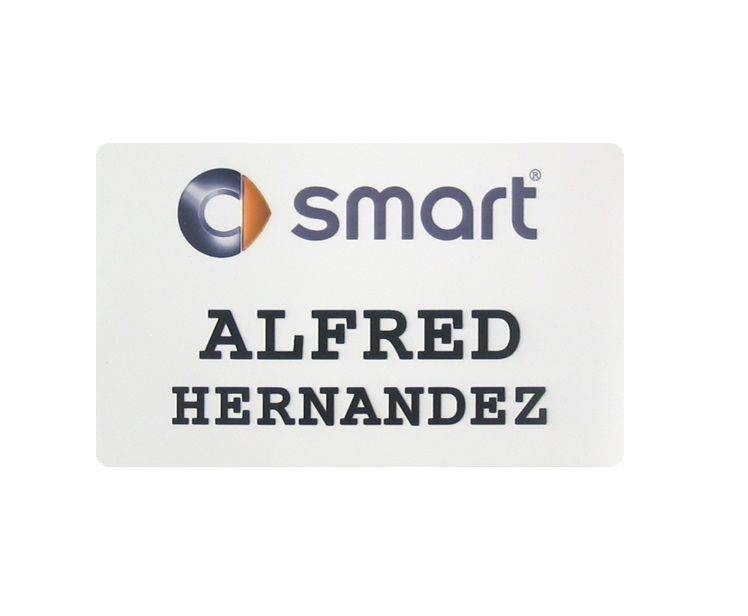 Sublimated white aluminum name badge with corporate logo and name.