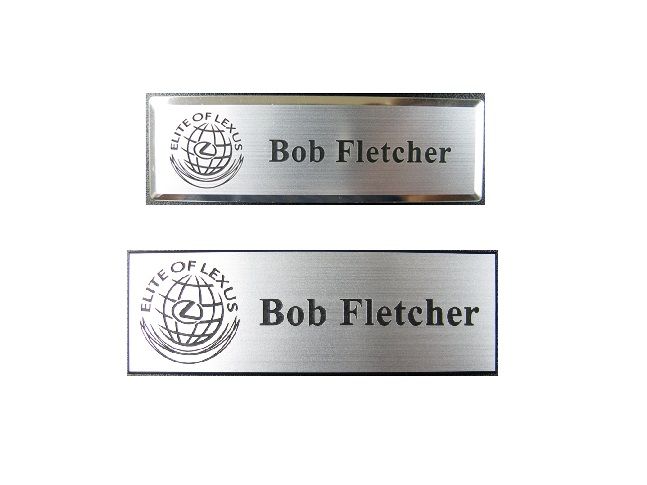 Laser engraved brushed aluminum plastic name badge on small silver premier.