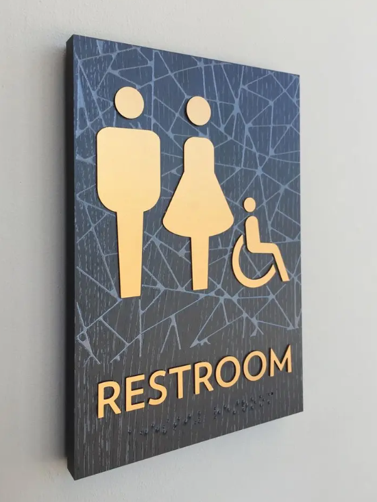 ADA compliant raised letter/braille restroom signs.