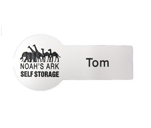 Round with tab shaped name badge.