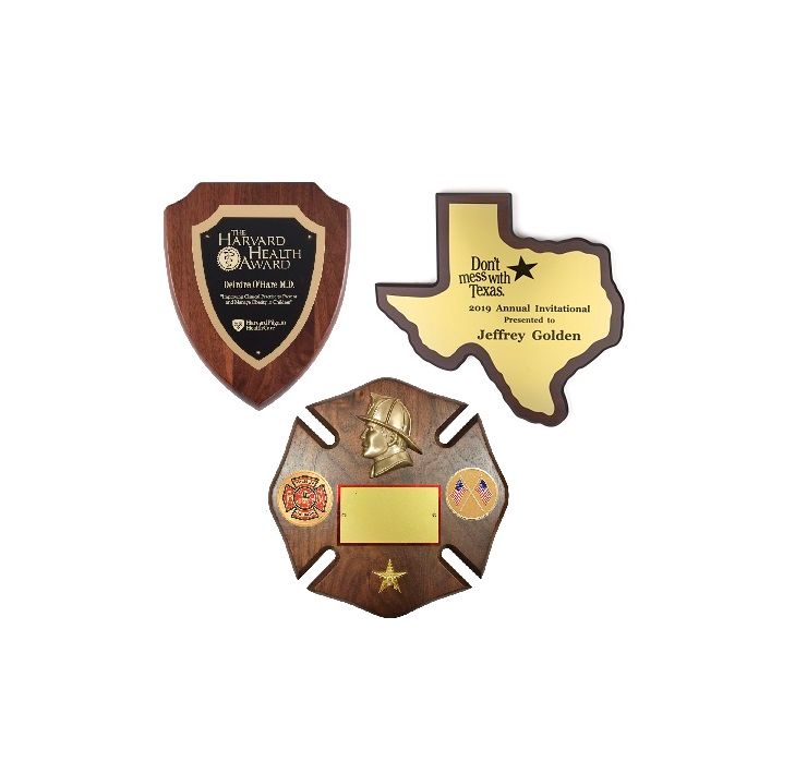 Shield, Texas, and Fire shaped award plaques.