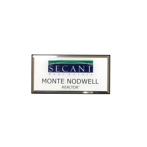 Sublimated white aluminum name badge with protective dome on large silver premier frame.