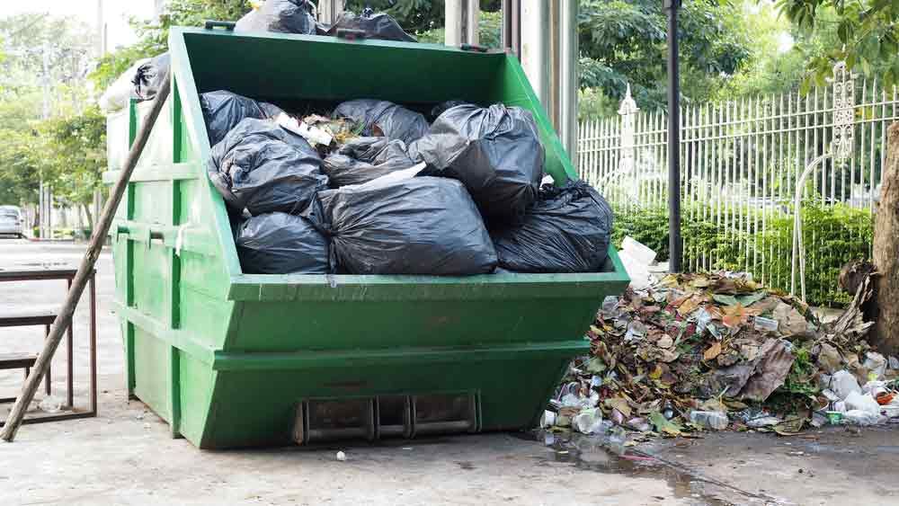 Big Green Skip Bin Full Of Garbage Bags Big Green Skip Bin Full Of Garbage Bags