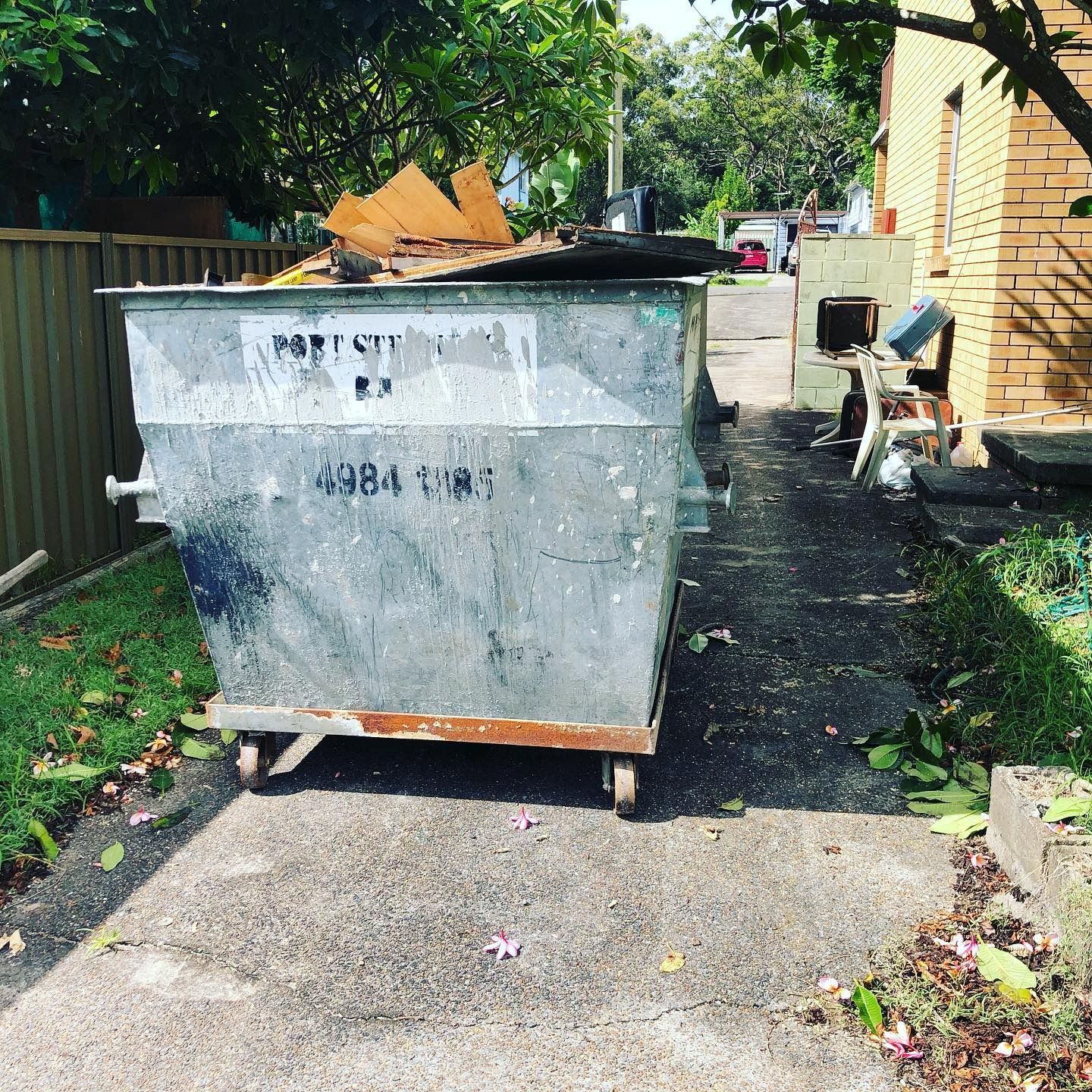 Large Metal Skip Bin Filled With Wooden Debris