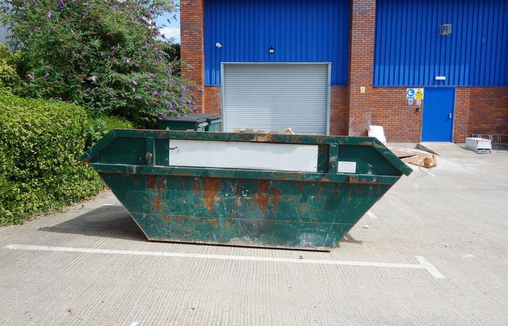 Green Metal Bin On The On Car Park - Skip Bin Hire in Tea Gardens, NSW