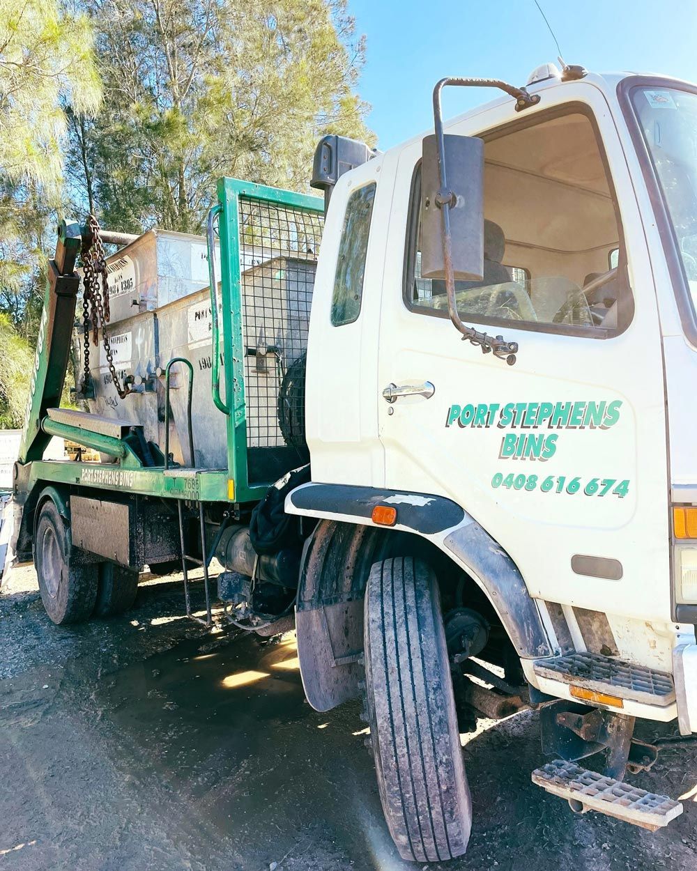 An Overfilled Green Skip Bin An Overfilled Green Skip Bin