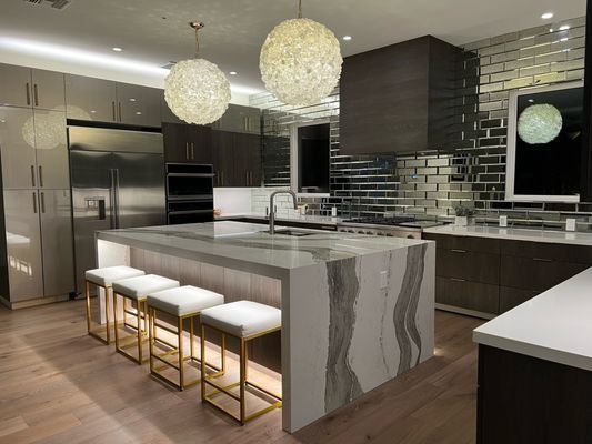 Rebuilt kitchen with waterfall island after fire damage restoration in Orlando FL